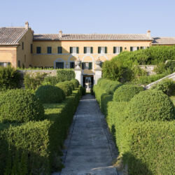 Villa La Foce, Tuscany, Italy. Large garden with topiary clipped Box hedging and views across the Tuscan countryside