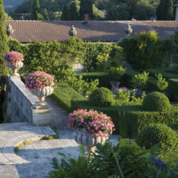 Villa La Foce, Tuscany, Italy. Large garden with topiary clipped Box hedging and views across the Tuscan countryside
