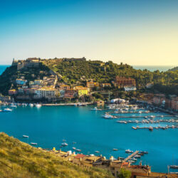 Porto Ercole village and boats in harbor in a sea bay. Aerial view. Monte Argentario, Maremma Grosseto Tuscany, Italy